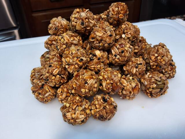 Freshly hand-rolling Buki Bites energy bites in the kitchen